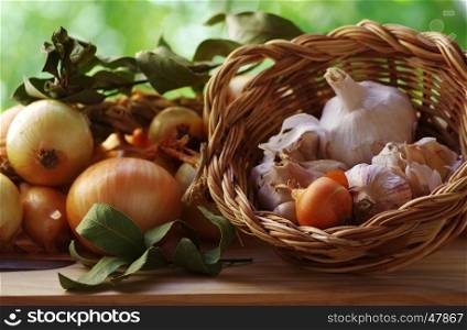 garlic and onions on table and basket