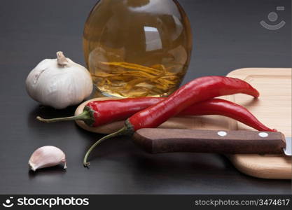 garlic and red chili peppers on the kitchen table