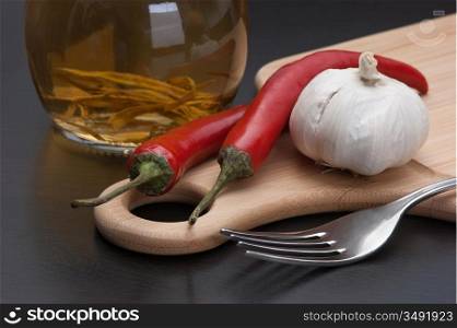garlic and red chili peppers on the kitchen table