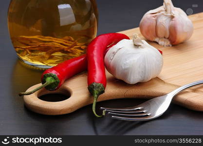 garlic and red chili peppers on the kitchen table