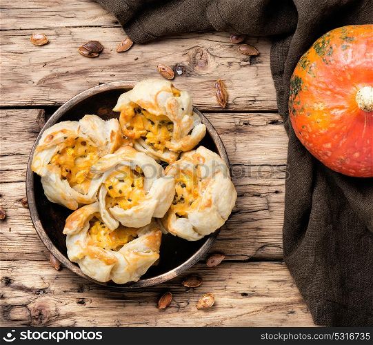 garlic biscuits with pumpkin. autumn pumpkin bun on retro wood background