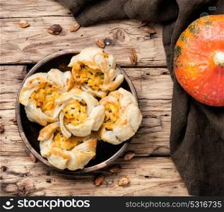 garlic biscuits with pumpkin. autumn pumpkin bun on retro wood background