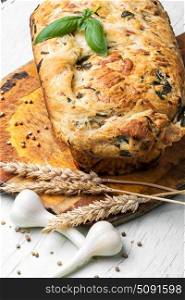 Garlic bread with basil. fresh loaf of rustic bread with garlic and herbs