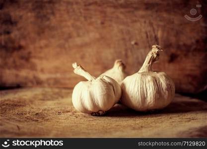 Garlic bulbs and cloves with vignette ,retro ,vintage