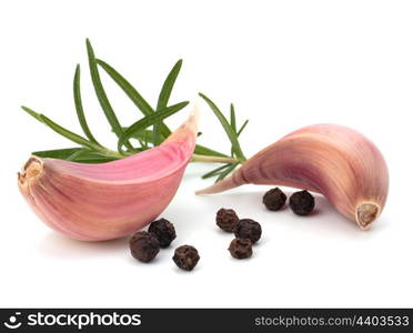 Garlic clove and rosemary leaf isolated on white background