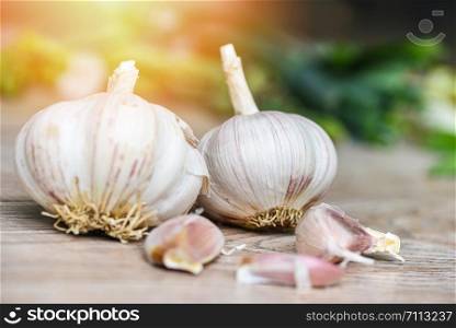 Garlic Cloves and fresh garlic bulb on wooden background forherbs and spices ingredients spicy food Asian