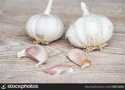 Garlic Cloves and fresh garlic bulb on wooden background forherbs and spices ingredients spicy food Asian