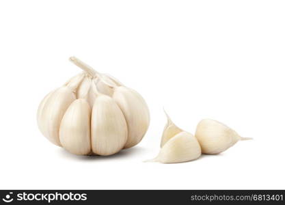 Garlic head and cloves on white background with path