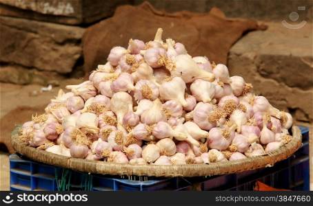 Garlic in a wicker basket on the market in Kathmandu, Nepal.&#xA;