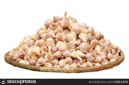 Garlic in a wicker basket on tne white background, isolate&#xA;