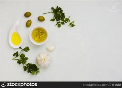 garlic infused olive with olives parsley leaves white background