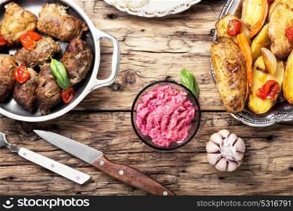 garlic juicy meatloaf. Juicy meatloaf with baked potatoes in a rustic way