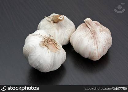 garlic on a kitchen cutting board