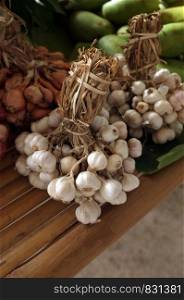 Garlic on market table closeup photo