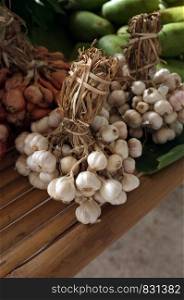 Garlic on market table closeup photo