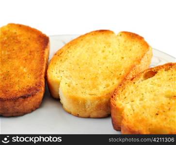 garlic toasts on a plate , close up