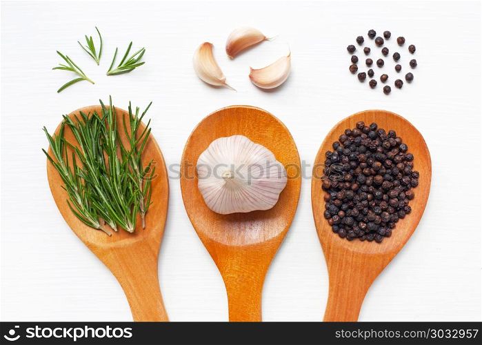 Garlic with rosemary and black peppercorn white.. Garlic with rosemary and black peppercorn white background.