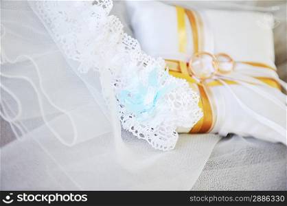 Garter and wedding rings close up