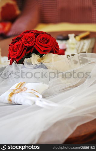 Garter, roses and wedding rings