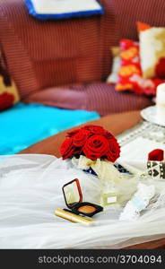 Garter, roses, cosmetics and wedding rings