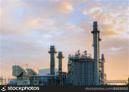 Gas combine electrical power plant at dusk with blue sky is support all factory in industrial estate
