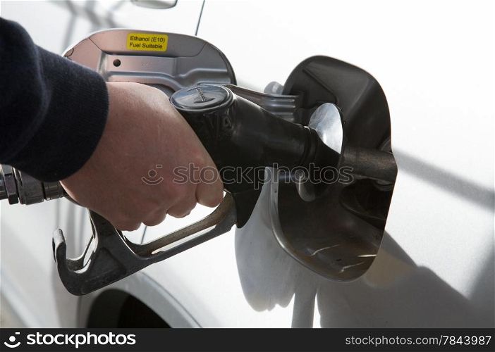 Gas Petrol Filling Station. Person filling gas at station