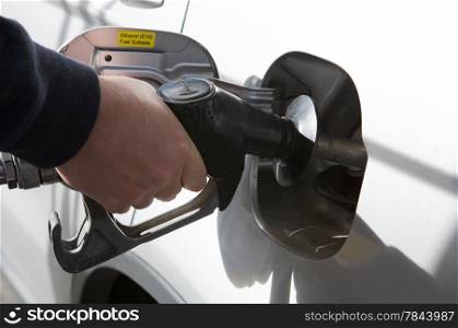 Gas Petrol Filling Station. Person filling gas at station