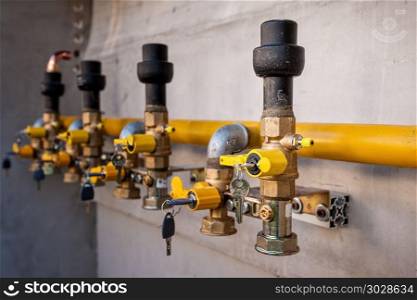 Gas pipe and valve with lock.. Gas pipe and valve with lock on the wall.