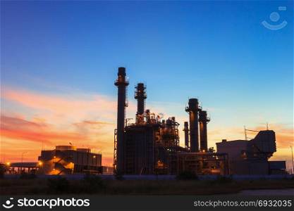 Gas turbine electrical power plant at dusk with sunset