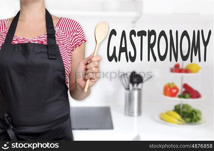 gastronomy cook holding wooden spoon concept background. gastronomy cook holding wooden spoon concept background.
