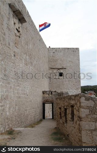 Gate of fortress and flag in Shibenik, Croatia