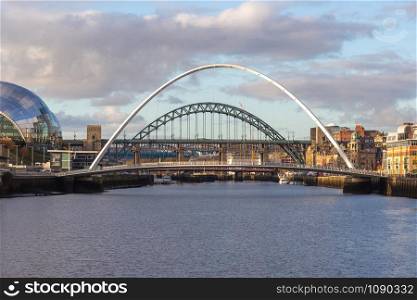 Gateshead Millennium and Tyne Bridge over the River Tyne, Newcastle, UK with Gateshead Sage building, the High Level and the Queen Elizabeth II bridges in the background