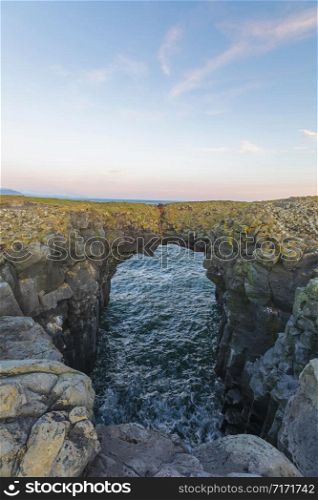 Gatklettur or Hellnar Arch is a famous, naturally formed stone arch on the Sn?ï¿½fellsnes Peninsula. Arnarstapi, Iceland