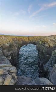 Gatklettur or Hellnar Arch is a famous, naturally formed stone arch on the Sn?ï¿½fellsnes Peninsula. Arnarstapi, Iceland