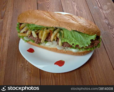 Gatsby - South African sandwich.Different varieties of Gatsbys include masala steak, chicken, polony, Vienna sausage, calamari, fish, and chargrilled steak.