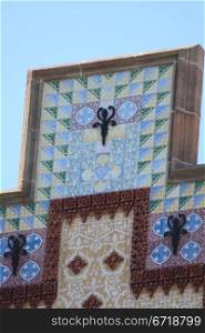 Gaudi mosaics on a facade in Barcelona