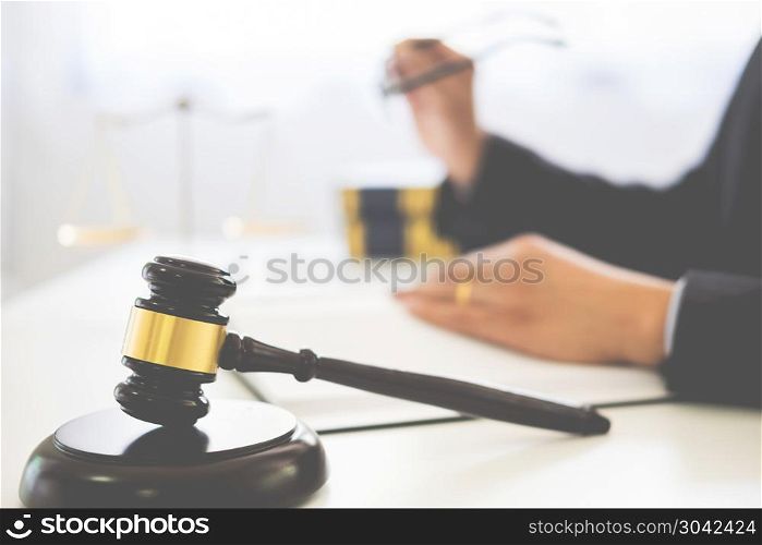 gavel and soundblock of justice law and lawyer working on wooden desk background. gavel and soundblock of justice law and lawyer working on wooden