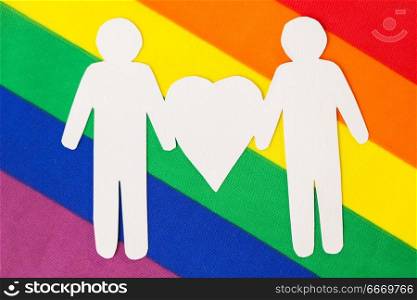 gay pride, homosexual and lgbt concept -male couple white paper pictogram on rainbow flag background. male couple pictogram on rainbow flag background. male couple pictogram on rainbow flag background