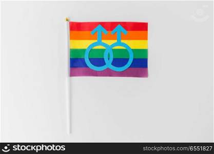 gay pride, homosexual and lgbt concept - male gender symbol on rainbow flag over white background. rainbow flag with mars symbol on white background. rainbow flag with mars symbol on white background