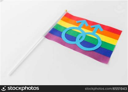 gay pride, homosexual and lgbt concept - male gender symbol on rainbow flag over white background. rainbow flag with mars symbol on white background. rainbow flag with mars symbol on white background