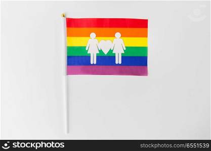 gay pride, homosexual and lgbt concept - rainbow flag with female couple white paper pictogram. rainbow flag with female couple white pictogram. rainbow flag with female couple white pictogram