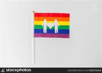 gay pride, homosexual and lgbt concept - rainbow flag with male couple white paper pictogram. rainbow flag with male couple white pictogram. rainbow flag with male couple white pictogram