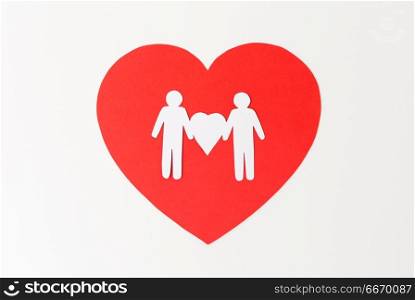gay pride, homosexual, valentines day and lgbt concept - male couple white paper pictogram on red heart. male couple white paper pictogram on red heart. male couple white paper pictogram on red heart