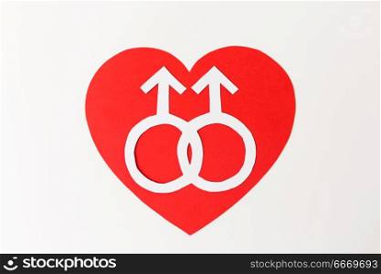 gay pride, homosexual, valentines day and lgbt concept - mars or male gender symbol on red heart over white background. mars symbol on red heart over white background. mars symbol on red heart over white background