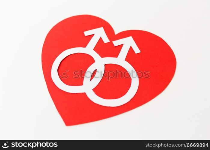 gay pride, homosexual, valentines day and lgbt concept - mars or male gender symbol on red heart over white background. mars symbol on red heart over white background. mars symbol on red heart over white background