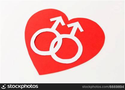 gay pride, homosexual, valentines day and lgbt concept - mars or male gender symbol on red heart over white background. mars symbol on red heart over white background. mars symbol on red heart over white background