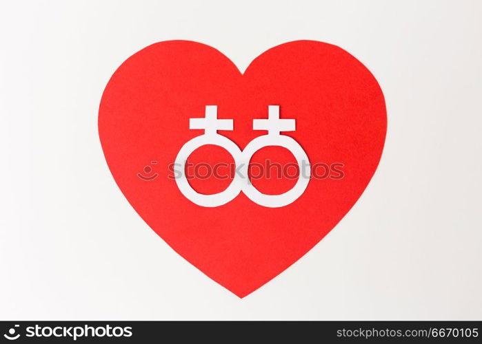 gay pride, homosexual, valentines day and lgbt concept - venus or female gender symbol on red heart over white background. venus symbol on red heart over white background. venus symbol on red heart over white background