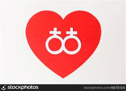gay pride, homosexual, valentines day and lgbt concept - venus or female gender symbol on red heart over white background. venus symbol on red heart over white background. venus symbol on red heart over white background