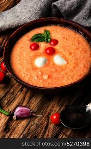 Gazpacho rustic soup. Gazpacho soup with tomato on retro wooden background