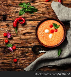 Gazpacho rustic soup. Gazpacho soup with tomato on retro wooden background